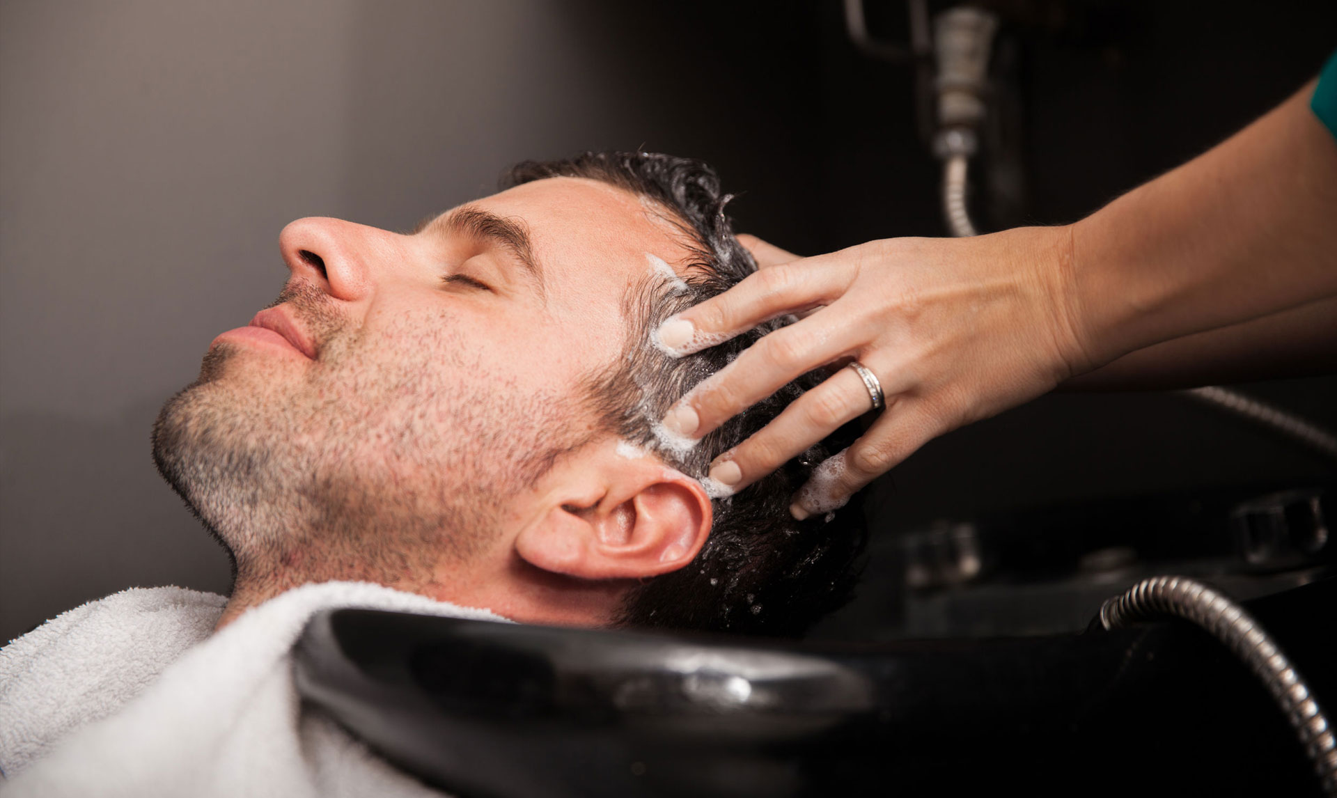 Barber giving a client a haircut